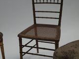 two chairs and a stool sitting next to each other on a white surface