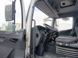 a truck with the door open and the driver ' s seat down