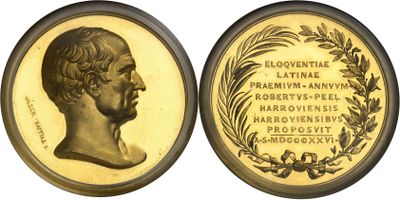 a close up of a gold coin with a portrait of a man