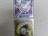 two pokemon cards are sitting next to each other on a table
