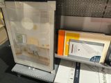a picture of a picture of a desk and some books on a shelf