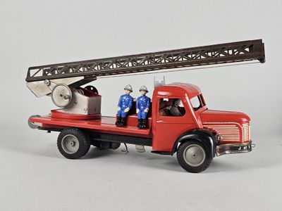 a red fire truck with two men on the back of it