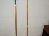 two pitchforkes that are standing next to each other