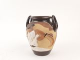 a brown vase with a picture of a woman on it