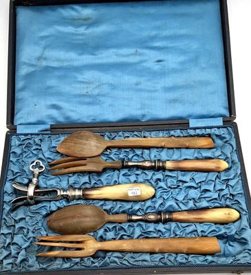 a case with a set of wooden utensils in it