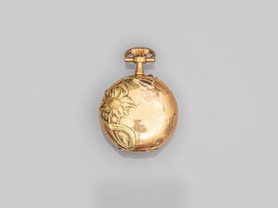 an image of a gold pocket watch on a white surface