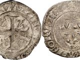 a group of four silver coins with faces on them