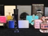 many different types of perfume bottles on a table