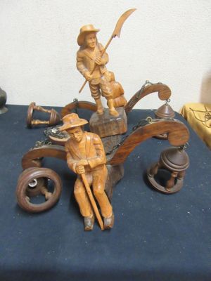 statue of a man and a woman in a boat on a table