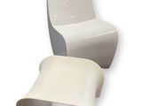 pair of white chairs and a table on a white background