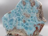 a picture of a piece of blue and white marble on a clear base