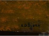 a close up of a piece of wood with a brown paint on it