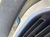 a close up of a car ' s grille with a sticker on it