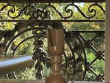 a vase on a table with a view of the eiffel tower in the background