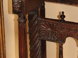 a wooden table with a carved top in a room