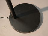 a black lamp that is on a white table