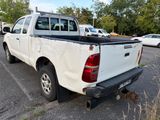 a white pick up truck parked in a parking lot