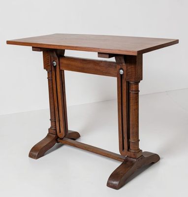 a wooden table with two legs and a wooden top