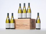 six bottles of wine in a wooden crate with a white background