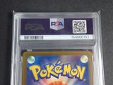 the pokemon card is in a plastic holder on a table