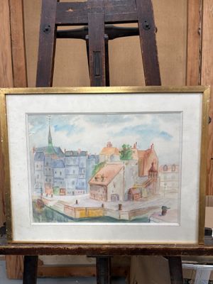 une image d'un tableau sur un chevalet dans une pièce