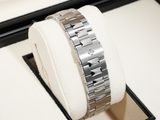 a watch that is sitting on top of a watch box