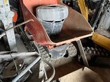 a pile of construction equipment sitting in a garage