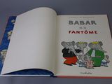 an open book with a picture of a group of people