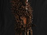 une photo d'une sculpture représentant un lion, réalisée en bois