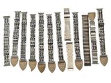 several different types of watch bands are lined up on a white surface