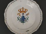 a plate with a crown on it sitting on a table