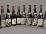 several bottles of wine are lined up in a row