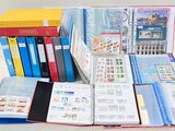 many different types of stamps and folders on the table