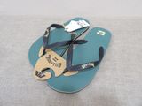 a pair of blue flip flops with a tag on them