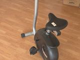 a stationary exercise bike in the corner of a room