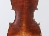 an old violin with a wooden back and bow on a white background