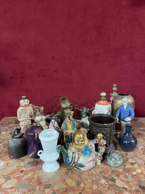 a lot of figurines on a table with a red background