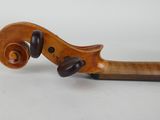 an old violin with a wooden handle on a white background
