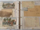 an open book with a bunch of old postcards on it