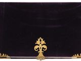 an image of a black and gold clutch bag on a white background