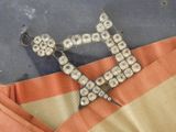 an image of a pair of scissors laying on top of a piece of cloth