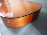 a close up of a guitar on a table