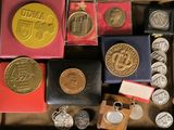 a box with a lot of coins in it