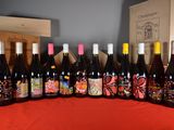 several bottles of wine are lined up on a table
