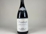 a bottle of wine that is sitting on a table