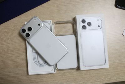 two iphones that are sitting on a table next to each other