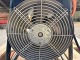 a fan that is sitting on top of a pallet