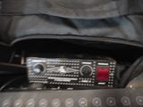 a radio sitting in the back of a black bag
