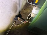 a picture of a water heater that is connected to a wall