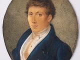 portrait d'un homme vêtu d'une veste bleue et d'une chemise blanche